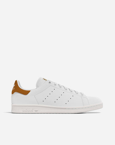 Adidas Stan Smith White Ochre
Premium soft leather upper
Lace closure
Full grain leather upper
Rubber cupsole; Leather lining
Enjoy the comfort and performance of OrthoLite® sockliner
Rubber cupsole
Product colour: Core White / Dark Blue / Dark Blue
Product code: M20325